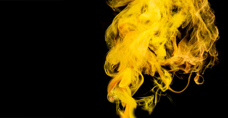 Yellow color abstract smoke making background on black
