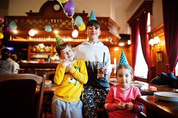 Obraz premium Three children on birthday party.