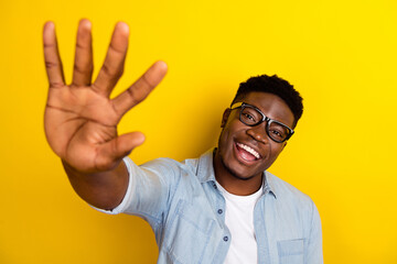 Photo of cheerful guy manager done project partner give high five gesture in camera isolated vivid color background