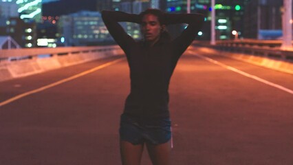 Woman resting, after running in city at night for fitness, health and cardio. Healthy, tired and exercise street runner relaxing after run in the morning or training marathon, sport or workout