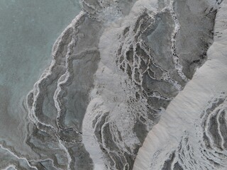 Pamukkale Travertines Cinematic Aerial Drone footage. Turkish famous white thermal bath with healthy clean water in a beautiful sunset. 