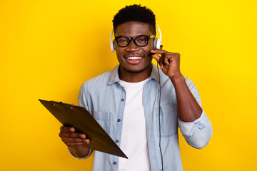 Photo of funny millennial brunet guy call client wear eyewear jeans shirt isolated on yellow color...