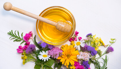 Bowl with honey and various wildflowers
