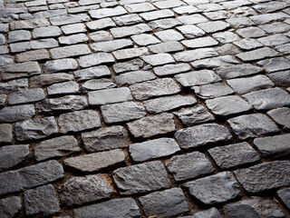 paving stones made of old granite worn out by time