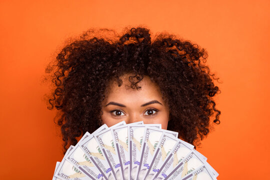 Photo of impressed wavy lady close face money isolated on orange color background