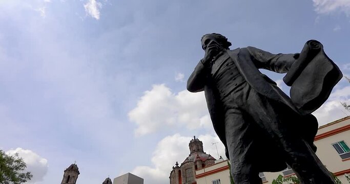 Mexico City, CDMX, Mexico, OCT, 16 2021, Francisco Zarco Monument with Church of San Hipolito in the background