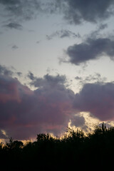 Pink and purple clouds at sunset. Natural background for screensavers. High quality photo