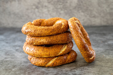 Sesame bagel. Turkish bagel on dark background. Bakery products. close up