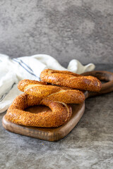 Sesame bagel. Turkish bagel on dark background. Bakery products. close up