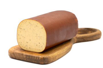 Black Pepper Smoked Cheese. Dutch smoked cheese isolated on a white background. close up