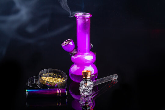 Premium Photo  Vertical shot of bong and pipe filled with weed
