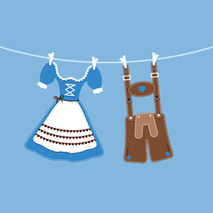 H&auml;ngendes Dirndl & Lederhose Blau Braun Blauer Hintergrund