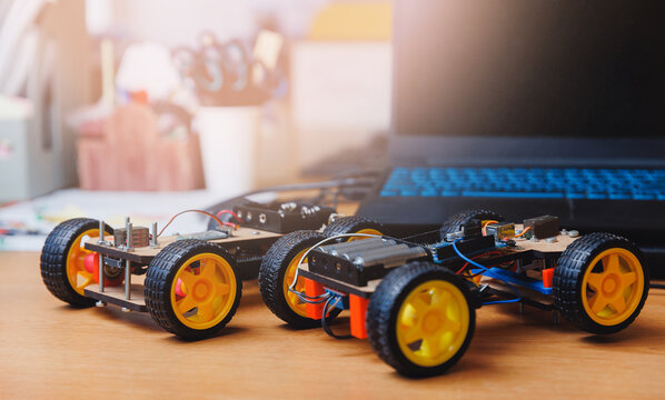 Homemade toy cars with microcontroller for teaching engineers to children