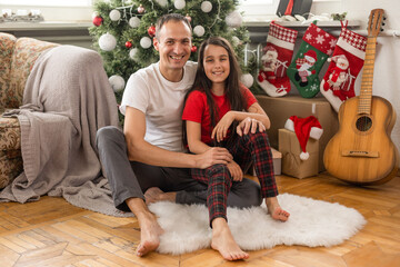 family, christmas, x-mas, happiness and people concept - smiling father and daughter.