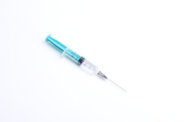 Fototapeta premium Medical syringe on a white background. A syringe for injection. The concept of health and beauty