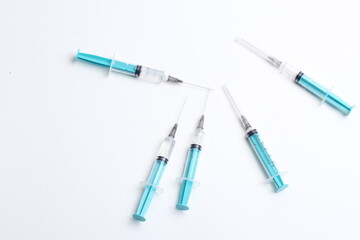 Medical syringe on a white background. A syringe for injection. The concept of health and beauty