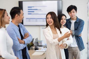 Business people working and brainstorming in office