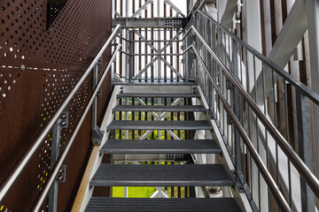 Steel construction with iron staircase and stainless steel handrail