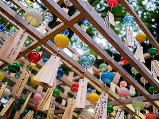 Colorful wind chimes blowing in the wind to celebrate love at a Japanese shrine