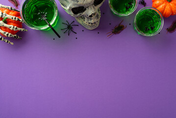 Halloween concept. Top view photo of green drink with floating spiders in glasses skull skeleton hand pumpkins insects centipede cockroach and confetti on isolated purple background with empty space