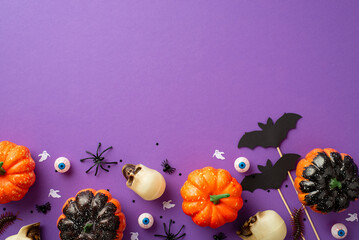 Halloween concept. Top view photo of pumpkins skulls eyeballs spiders centipedes ghost bat...