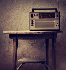 vintage radio over old rustic wooden background