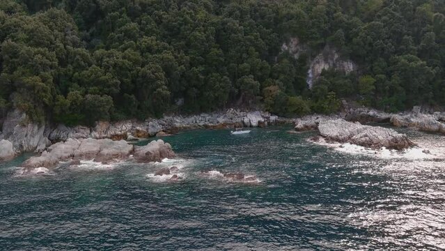 Small boat on rocky beach, Pelion, Greece, aerial
Drone view from rocky shore and sea of Greece, 2022

