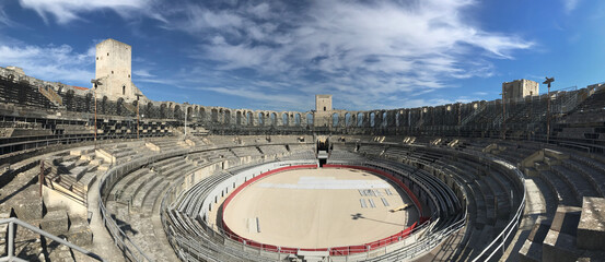 Interior of the Roman arena of Arles in the light of a summer morning in Provence, France.