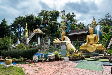 Wat Sinxayaram Temple in Vientiane of Laos, is present a “Kingdom of Buddhism” surrounded by mountains and forest, presents hundreds of golden Buddha images alongside religious structures and site