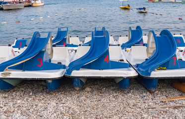 water catamarans on the beach of the resort town near the sea for tourists. Resort water transport....