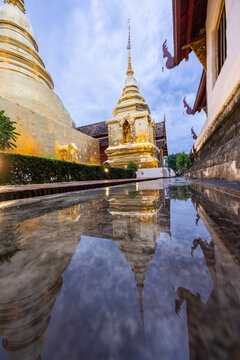 Beautiful Golden Royal Monastery in Thailand and reflections on the water surface

