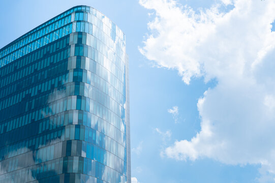 Glass wall architecture building reflection cloud and sky background.concept for modern office