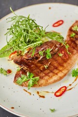 Beef tongue with sauce and herbs. A dish from the chef for serving in a restaurant.