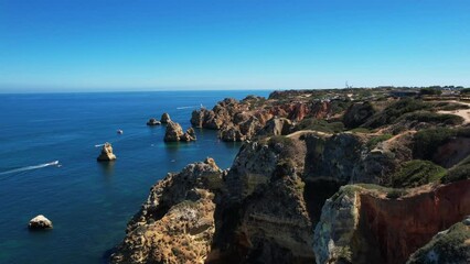 4K Praia Dona Ana beach with turquoise sea water and cliffs, Portugal. Beautiful Dona Ana Beach (Praia Dona Ana) in Lagos, Algarve, Portugal.