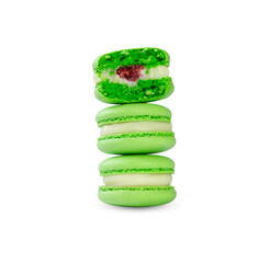 stack of green macarons isolated on white. macaron stuffed with raspberries