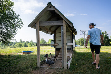 Marine veteran at home with family taking care of animals.