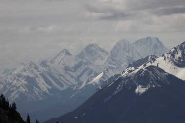 Fototapeta na wymiar Scenic View Of Majestic Snowcapped Mountains Against Sky At Banff Gondola