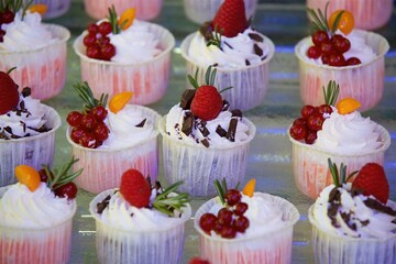 Beautiful and bright desserts on the festive table for the party.