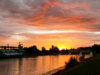 Naklejka premium sunset over the river