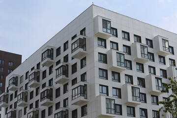 New building facade in housing complex "Green Park. PIK", Moscow city, Russia. Modern style in architecture. Contemporary house in dormitory area. Urban landmark, home. White facade of building
