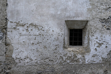 Thick wall with barred window, hitoric, europe