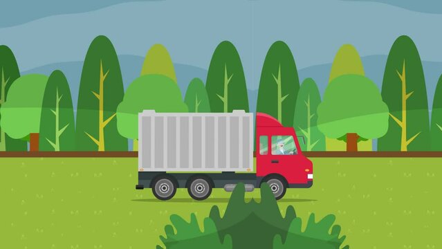 Red truck moving near green forest background