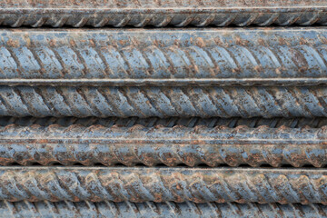steel rebar for reinforcement concrete at Construction site with house under construction background. Reinforcing Steel Bar closeup. 