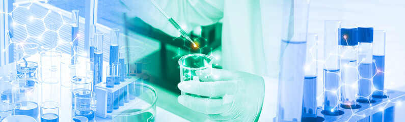 Hand of scientist with test tube and beaker in medical chemistry lab blue and green style banner background.