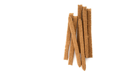 Creative layout made of crackers sticks on the white background. Food concept. Edible snack dry sticks with salt on white background. Straws, sticks crackers.