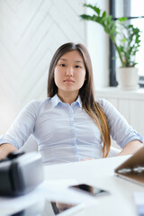 Post-Office Serenity: A Young Asian Woman Captured in Different Poses during a Relaxing Photoshoot