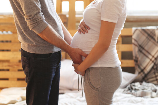 Love, Laughter, and a Little One: Pregnant Couple at Home