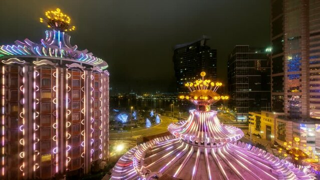 Timelapse of Casino building illuminated with traffic at night