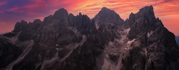 Raamstickers panoramic aerial view at dawn of the peaks of the pale si san martino in melting glaciers in Trentino © Massimo