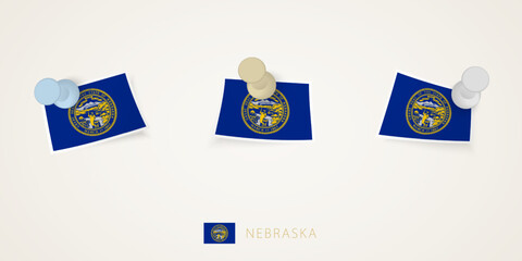 Pinned flag of Nebraska in different shapes with twisted corners. Vector pushpins top view.